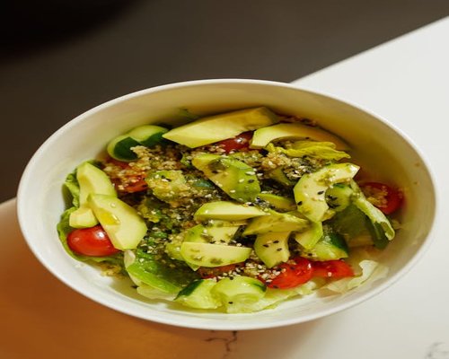 A healthy homemade lunch bowl with fresh salad and grains
